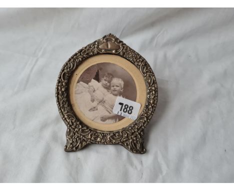 A fancy&nbsp;easel shaped photo frame with embossed decoration 6 inches high Birmingham 1899