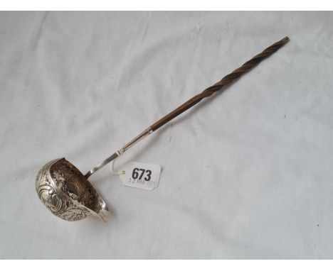 a Georgian tody ladle ( unmarked ) with whale bone handle