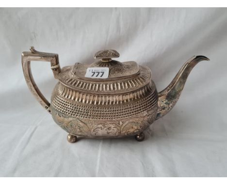 A George III teapot with chased decoration ball feet 10 1/2 inches over handle 1807 by A &amp; G Burrows 600 gms