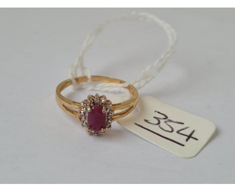 A oval ruby &amp; diamond ring in 9ct Gold - size N