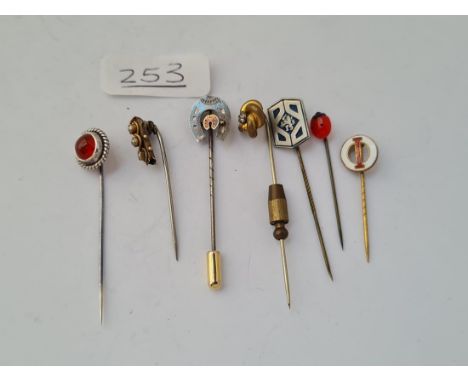 Seven assorted metal stick pins