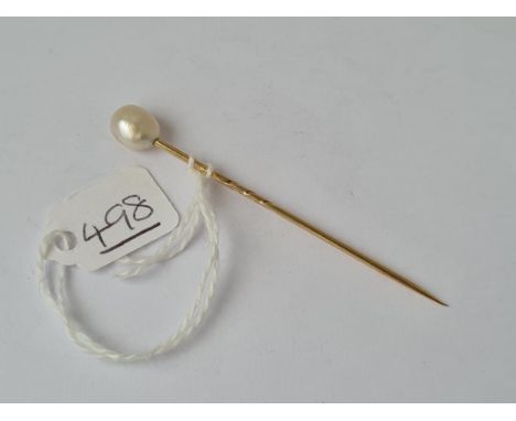 A large natural pearl stick pin in high carat