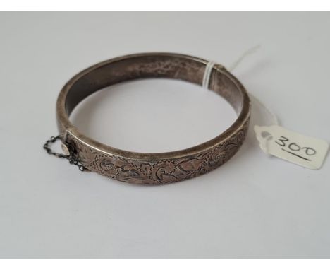 A vintage silver chased top hollow bangle - marked B'ham 1963