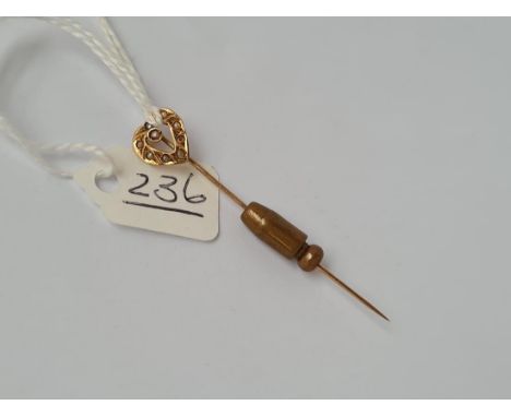 A seed pearl terminal stick pin (stone missing) in 10ct gold