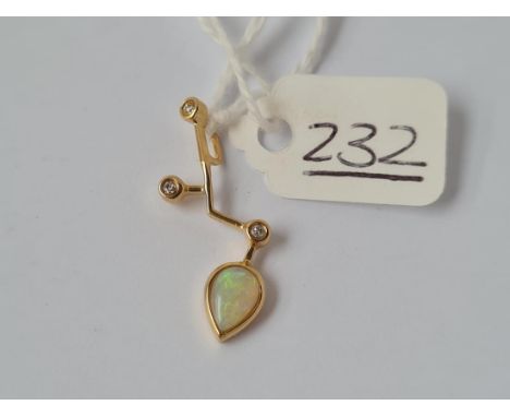 A gold opal &amp; diamond pendant in 14ct gold