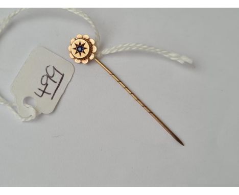 A sapphire &amp; pearl cluster stick pin in high carat gold