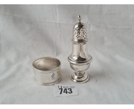 A baluster shaped pepper and a napkin ring