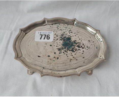 A George III shaped oval teapot stand on four scrolled feet 6 inches wide London 1798 by GB 150gms