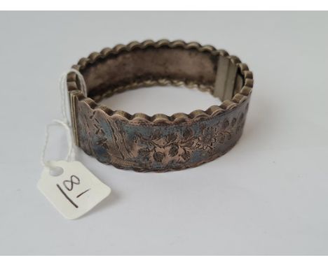 A silver hinged bangle