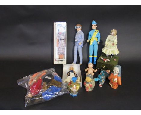 A box of mixed dolls including Qantas doll, talking Thunderbirds, automaton etc 