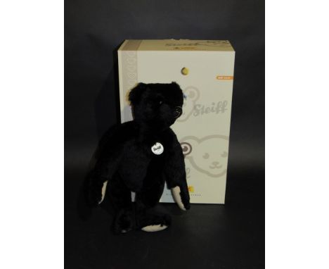 A boxed Steiff teddy bear in black 