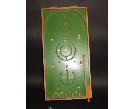 A bagatelle board with marbles 