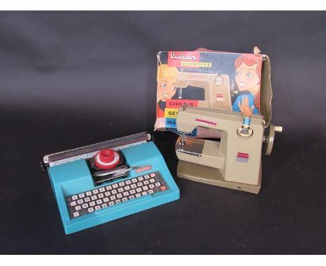 Boxed Vulcan childs sewing machine and Mettoy typewriter 