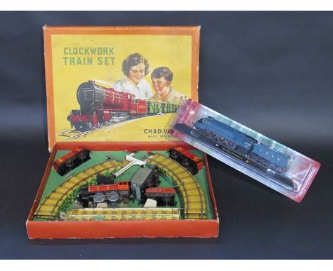 A boxed clockwork Chad Valley '0' gauge trainset and a model of 'Mallard'