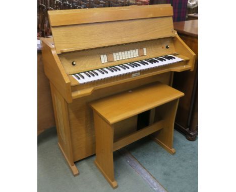 A light oak Livingston organ (af) and stool (2) Condition Report: Available upon request