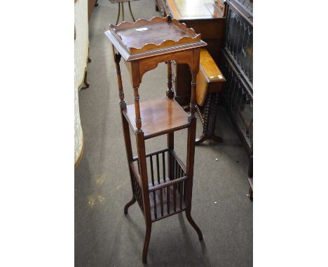 Edwardian three tier mahogany stand with galleried top, central shelf and a galleried section to base, raised on outswept leg