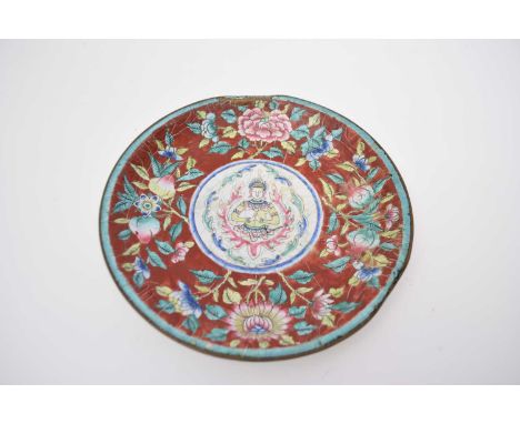 Chinese enamel plate, the centre decorated with a deity surrounded by peaches and floral design