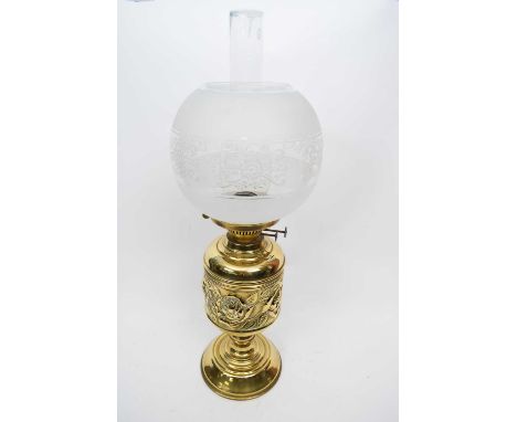 Brass lamp with floral design to shade