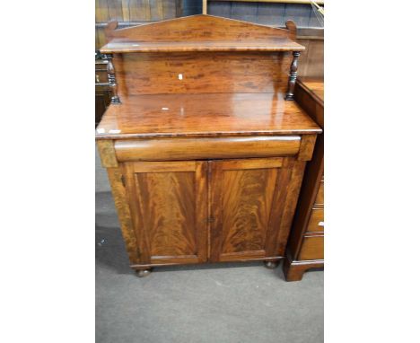 William IV or early Victorian mahogany chiffonier, single shelf back with turned supports over a frieze drawer and two panell