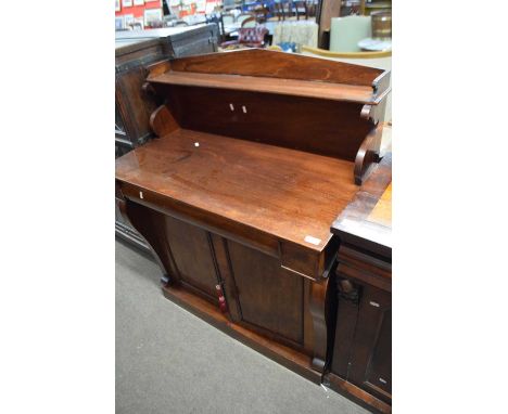 William IV or early Victorian mahogany chiffonier, the single shelf back with scroll supports over a base with frieze drawer 