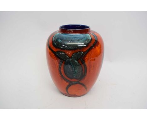 Poole Pottery vase, the red ground with grey blue decoration, 24cm high