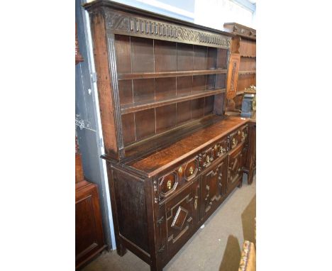 Jacobean Revival oak dresser with two shelf back over a base with three drawers and three doors with mitred decoration, 184cm