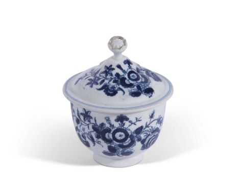 A Lowestoft porcelain sucrier and cover of unusual small size printed in blue with a version of the three flowers pattern10cm