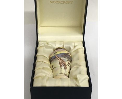 A boxed Moorcroft miniature vase decorated with giraffes. Height of vase 8.5cm approx