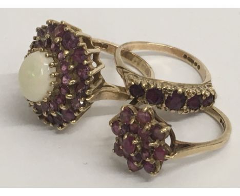 Three 9ct ruby rings, one with large Opal. Ring sizes O-P