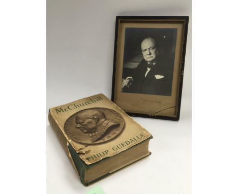 A signed black and white portrait print of Winston Churchill together with a Churchill biography by Philip Guedalla. Please n