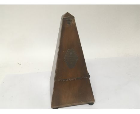 A vintage clockwork Metronome.