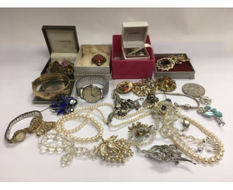 A collection of costume jewellery including a vintage watch, 1/5 gold bangle and other items.