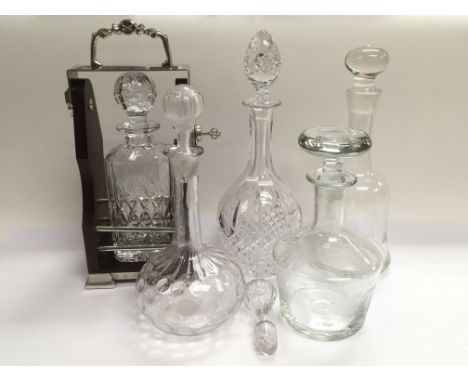 A decanter and tantalus together with four other decanters (5).