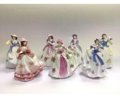 A collection of seven Royal Worcester figures of ladies.