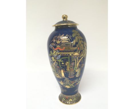 A large Carlton Ware porcelain vase and cover decorated in the oriental style with applied gilt on a powder blue ground. No d