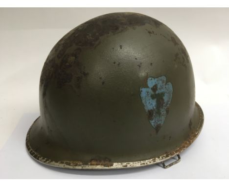 A WW2 US Schuleter Made Font Seam Swivel Bale M1 helmet with "Inland" made liner. Period hand painted 36th Infantry (Texas) I