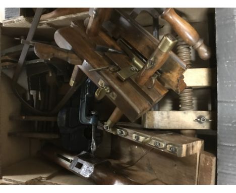 2 boxes of good antique woodworking tools including vice’s, moulding planes, saws etc.