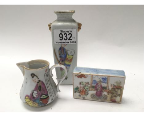 A small Famille Rose scroll weight together with a small porcelain jug and vase.