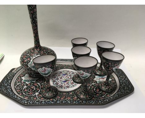 A Indian enamel tray with six matching cups and vase .