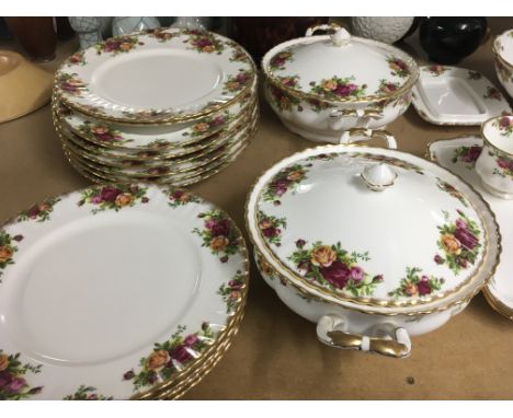 A Royal Albert country rose tea / dinner service including cups saucers tea pot jug dinner plates ,tureens