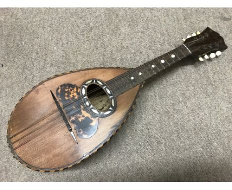 An Italian mandolin inlaid with mother of pearl and tortoiseshell