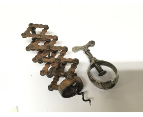A vintage concertina corkscrew. Stamped J.H.S B. Double no4283 and a vintage silver plated nut cracker (2)