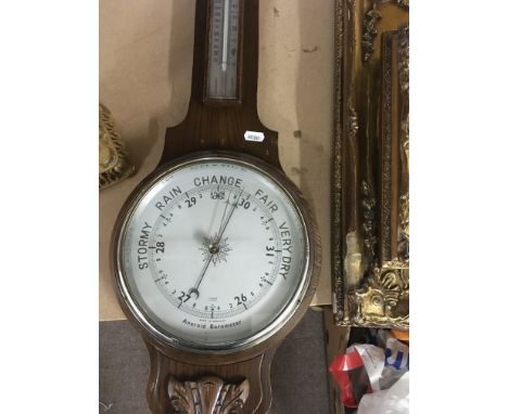 A oak barometer and a reproduction gilt mantel clock .