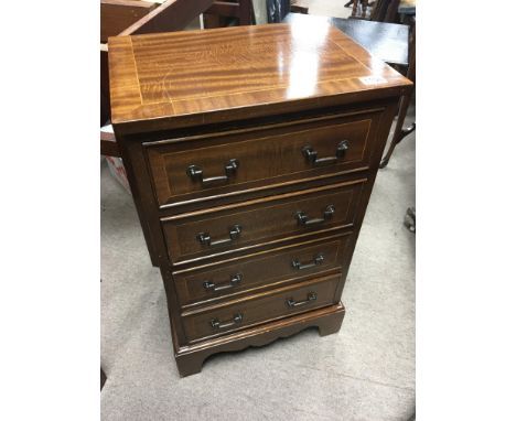 A small mahogany flight of four drawers on bracket feet 45x74cm