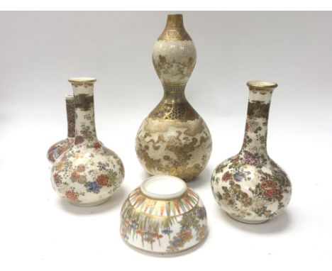 A small collection of Kutani pottery vases and one small bulbous satsuma vase.