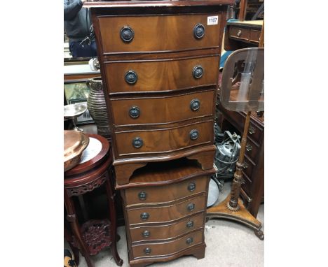 A pair of mahogany small flights of drawers each fitted with four drawers on bracket feet. 45cm wide hight 71cm