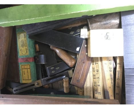 A box of antique woodworking tools including rule’s, squares, die sets, spacers etc