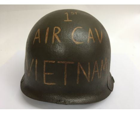 A Vietnam era M1 helmet found in Vietnam, with Post War memorial painting