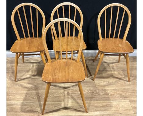 A set of four Ercol beech and elm dining chairs, 86cm high, 39.5cm wide, the seat 30cm deep (4)