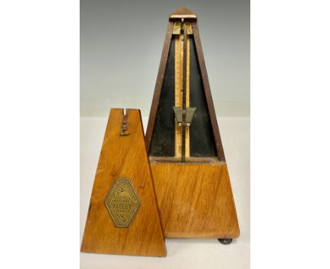 An early 20th century French walnut metronome